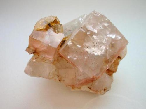 Even the most German collectors do not know the fluorites from Hühn fluorspar mine, Trusetal, Thuringia. In the 1950s in this mine crystals (cubes) were found, deep green and blue in color, measuring up to 5 cm, some on good baryte crystals. They look like the famous Halsbrücke fluorites from the Freiberg district, Saxony. The picture shows a 6 cm sample with pale blue cubes (some with rosé zoning at the edges). (Author: Andreas Gerstenberg)
