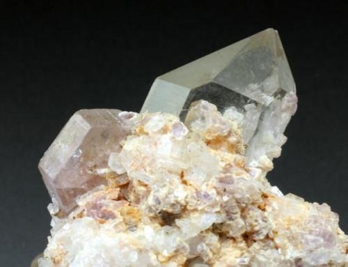 Apatite with quartz and lepidolite, Himalaya Mine. Apatite crystal is 1.5 cm across. (Author: Jesse Fisher)