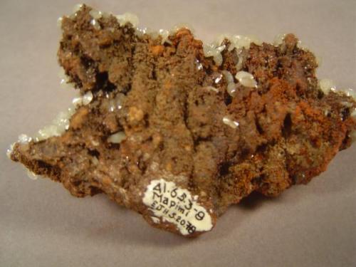 "Mixonite", Mina Ojuela, Mapimi, Durango, Mexico.  Backside of specimen in previous photograph.  This was acquired in 1978, as can be seen from the affixed label.  I see that I acquired the piece on my birthday that year. (Author: Ed Huskinson)