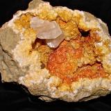 Calcites on DolomiteAfloramientos Carretera Estatal 56, Canton, Condado Washington, Indiana, USAGeode cavity is about 17 cm, Largest calcite is 3.7 cm (Author: Bob Harman)