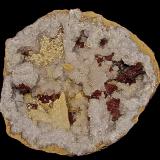 Calcite, Barite, Dolomite (variety iron rich dolomite) on QuartzBarranco Mission Valley, Condado Monroe, Indiana, USAgeode is 22 cm x 22 cm.    The largest calcite is 4.5 cm.     The barite groupings are up to 5.0 cm. The dolomite groupings are up to 4.0 cm (Author: Bob Harman)