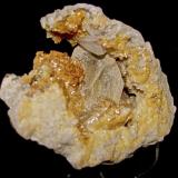 Baryte and Calcite on DolomiteAfloramientos Carretera Estatal 56, Canton, Condado Washington, Indiana, USAthe Barite crystal is about 3.5 cm. The calcite crystal is 2 cm. (Author: Bob Harman)