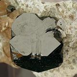 Bixbyite with Topaz
Thomas Range, Juab County, Utah, USA
Crystal size: 1.2 × 1.1 cm.
Photo: Reference Specimens
Detail (Author: Jordi Fabre)