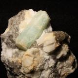 Beryl aquamarine on smokey quartz with feldspar
Tripp Mine, Alstead, New Hampshire, USA
Crystal is 5 cm long
Photo &amp; Specimen: Jessica Simonoff (Author: Jordi Fabre)