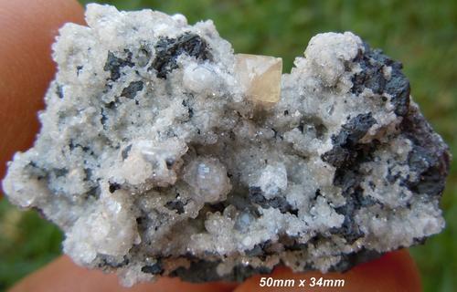 Kalahari manganese fields olmiite and calcite crystals on matrix-south africa.jpg (Author: Anton Potgieter)