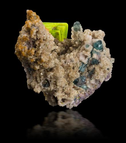 Meta-autunite on 'lepidolite' with Cookeite and Tourmaline (Group)<br />Golconda pegmatite, Governador Valadares, Vale do Rio Doce, Minas Gerais, Brazil<br />7 x 4 x 6.5 cm / main crystal: 2.2 cm<br /> (Author: MIM Museum)
