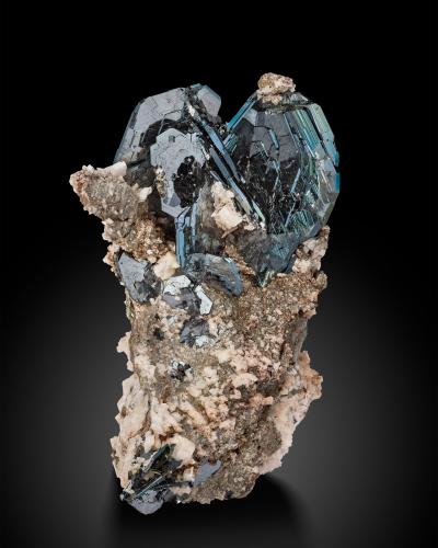 Hematite<br />Cavradi, Curnera Valley, Tujetsch (Tavetsch), Vorderrhein Valley, Grischun (Grisons; Graubünden), Switzerland<br />7 x 6.5 x 12 cm / main crystal: 5.2 cm.<br /> (Author: MIM Museum)