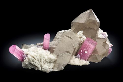 Elbaite with Quartz (variety smoky) Albite and 'lepidolite'<br />Paprok, Kamdesh District, Nuristan Province, Afghanistan<br />25 x 14 x 7.5 cm / main crystal: 5.8 cm.<br /> (Author: MIM Museum)