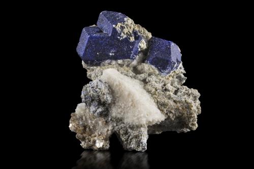 Lazurite with Calcite<br />Sar-e Sang, Koksha Valley, Khash & Kuran Wa Munjan Districts, Badakhshan Province, Afghanistan<br />8 x 10 x 7.5 cm / main crystal: 4.1 cm<br /> (Author: MIM Museum)