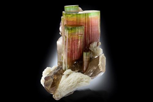 Elbaite with Orthoclase, 'lepidolite', Albite and Quartz (variety smoky)<br />Paprok, Kamdesh District, Nuristan Province, Afghanistan<br />14.5 x 12 x 16 cm / main crystal: 9.2 cm.<br /> (Author: MIM Museum)