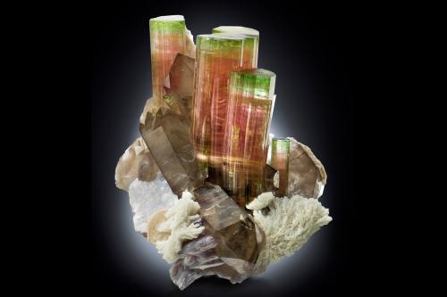 Elbaite with Orthoclase, 'lepidolite', Albite and Quartz (variety smoky)<br />Paprok, Kamdesh District, Nuristan Province, Afghanistan<br />14.5 x 12 x 16 cm / main crystal: 9.2 cm.<br /> (Author: MIM Museum)
