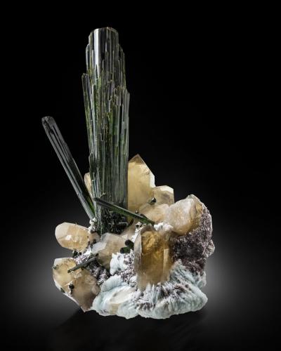 Elbaite (variety verdelite) on Quartz (variety smoky) and with Albite and 'lepidolite'<br />Cruzeiro Mine, Santa Maria do Suaçui, Governador Valadares, Vale do Rio Doce, Minas Gerais, Brazil<br />56 x 37 x 45 cm / main crystal: 49 cm<br /> (Author: MIM Museum)
