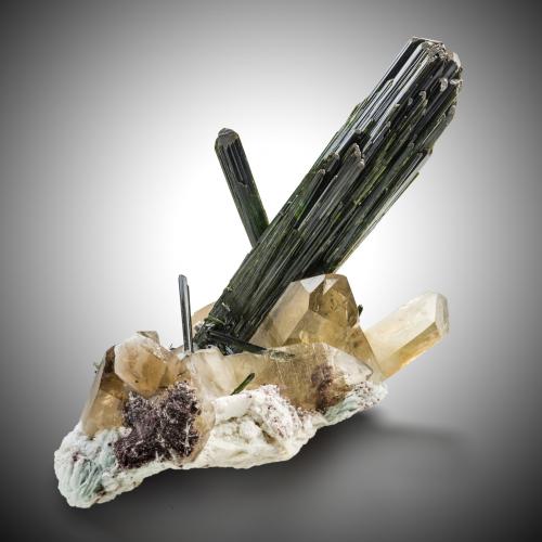 Elbaite (variety verdelite) on Quartz (variety smoky) and with Albite and 'lepidolite'<br />Cruzeiro Mine, Santa Maria do Suaçui, Governador Valadares, Vale do Rio Doce, Minas Gerais, Brazil<br />56 x 37 x 45 cm / main crystal: 49 cm<br /> (Author: MIM Museum)