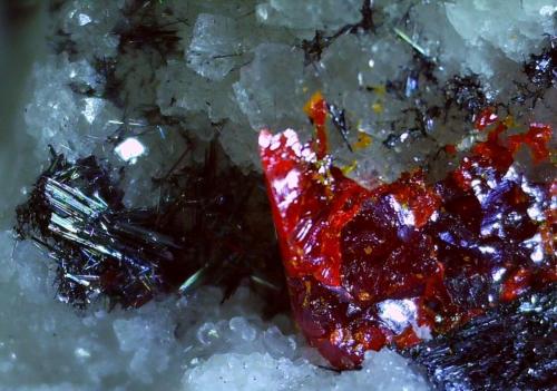 Dufrenoysite, Realgar<br />Lengenbach Quarry, Fäld, Binn Valley (Binntal), Wallis (Valais), Switzerland<br />6 x 4 mm<br /> (Author: Volkmar Stingl)