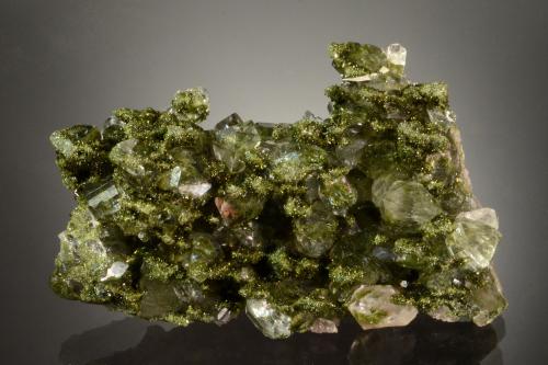 Epidote on Quartz<br />Hakkâri District, Hakkâri Province, Turkey<br />6.0 x 3.9 x 2.9 cm<br /> (Author: Michael Shaw)
