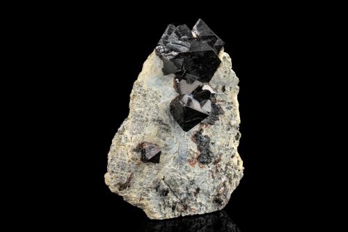 Hercynite<br />Kaluganga Valley, Ratnapura, Ratnapura District, Sabaragamuwa Province, Sri Lanka<br />8 x 3 x 10 cm / main crystal: 3.6 cm.<br /> (Author: MIM Museum)
