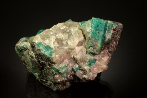 Beryl (variety emerald)<br />Carnaíba mining district, Campo Formoso ultramafic complex, Pindobaçu, Centro-Norte Baiano, Bahia, Northeast Region, Brazil<br />8.9 x 5.8 x 5.2 cm<br /> (Author: Michael Shaw)