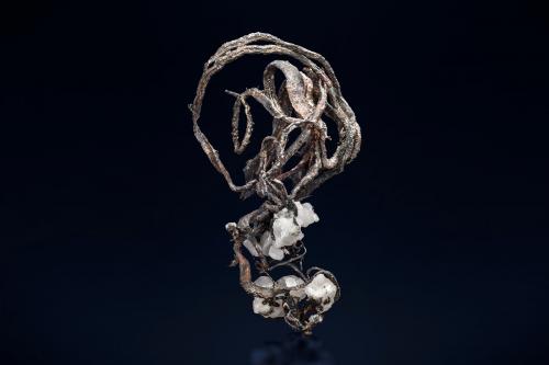 Silver with Calcite<br />Kongsberg mining district, Kongsberg, Norway<br />7.5 x 7 x 12 cm<br /> (Author: MIM Museum)