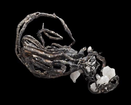 Silver with Calcite<br />Kongsberg mining district, Kongsberg, Norway<br />7.5 x 7 x 12 cm<br /> (Author: MIM Museum)