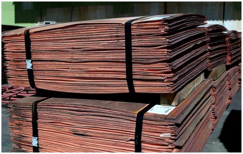 REFINED COPPER CATHODES

Like most modern Copper mines, Milpillas produced large, high-purity "Grade A cathodic Copper" sheets, adhering to LME (London Metal Exchange) and ATSM standards (American Society for Testing and Materials). These sheets commonly measured around 914mm x 914mm (36" x 36") with a thickness of about 12mm (0.5") and bundled in stacks of 50 sheets as shown in photograph. Each sheet weighed approximately 90 kilograms (198 pounds), making them efficient to handle and transport in industrial quantities. 

Grade “A” cathodic Copper sheets, are the purest form of commercially traded Copper, typically boasting a minimum purity of 99.99%. The physical properties of Grade “A” cathodic Copper sheets are directly linked to their high purity. They exhibit exceptional electrical conductivity, second only to silver, making them indispensable for electrical wiring, cables, and electronic components. They also possess high thermal conductivity, crucial for heat exchangers and refrigeration. Furthermore, these sheets are highly malleable and ductile, allowing them to be easily shaped, drawn into fine wires, or rolled into thin sheets without fracturing. They are also corrosion-resistant, particularly in atmospheric and aqueous environments, due to the formation of a protective oxide layer. Their uniform rectangular shape and consistent composition simplify industrial handling and processing.

Original photos courtesy of Dagoberto Flores (Author: silvia)