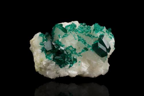 Dioptase on Calcite<br />Tsumeb Mine, Tsumeb, Otjikoto Region, Namibia<br />6 x 4.5 x 3.5 cm / main crystal: 1.6 cm<br /> (Author: MIM Museum)