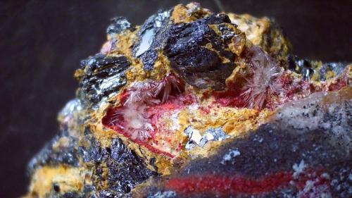 Klebelsbergite, Metastibnite, Stibnite<br />Pereta Mine, Pereta, Magliano in Toscana, Grosseto Province, Toscana, Italy<br />FoV ca. 2 x 1 cm<br /> (Author: Volkmar Stingl)