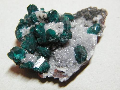 Dioptase on Calcite<br />Tsumeb Mine, Tsumeb, Otjikoto Region, Namibia<br />50x35mm<br /> (Author: Heimo Hellwig)