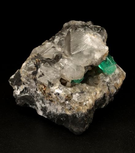 Beryl (variety emerald), Calcite, Pyrite<br />La Pita mining district, Municipio Maripí, Western Emerald Belt, Boyacá Department, Colombia<br />7cm across<br /> (Author: Fiebre Verde)