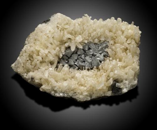 Antimony with Calcite<br />Lake George Antimony Mine, Lake George, Prince William Parish, York County, New Brunswick, Canada<br />18,0	x	13,0	x	6,0	cm<br /> (Author: MIM Museum)