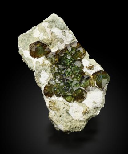 Andradite<br />Antetezambato outcrop, Antetezambato, Maherivaratra Commune, Ambanja District, Antsiranana Province, Madagascar<br />14,5	x	8,5	x	4,5	cm<br /> (Author: MIM Museum)