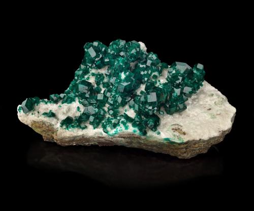 Dioptase on Calcite<br />Tsumeb Mine, Tsumeb, Otjikoto Region, Namibia<br />26,0	x	13,0	x	12,5	cm<br /> (Author: MIM Museum)