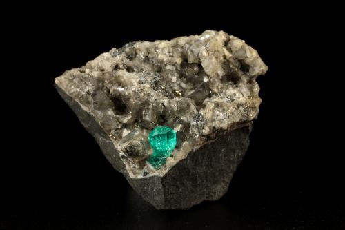 Beryl (variety emerald), Calcite, Dolomite, Pyrite<br />Chivor mining district, Municipio Chivor, Eastern Emerald Belt, Boyacá Department, Colombia<br />44x34x39mm, xl=7mm<br /> (Author: Fiebre Verde)