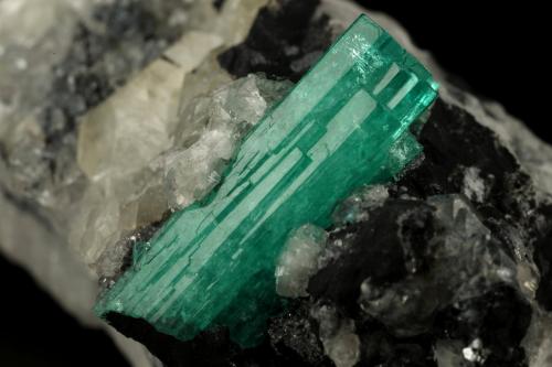 Beryl (variety emerald), Calcite<br />Muzo mining district, Western Emerald Belt, Boyacá Department, Colombia<br />58x31x34mm, xl aggregate=25x8mm<br /> (Author: Fiebre Verde)