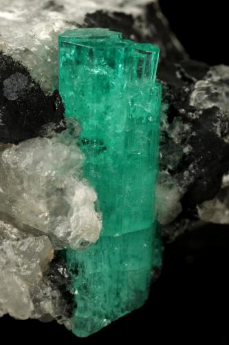 Beryl (variety emerald), Calcite<br />Muzo mining district, Western Emerald Belt, Boyacá Department, Colombia<br />58x31x34mm, xl aggregate=25x8mm<br /> (Author: Fiebre Verde)