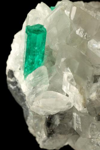 Beryl (variety emerald), Calcite<br />La Pita mining district, Municipio Maripí, Western Emerald Belt, Boyacá Department, Colombia<br />35x38x37mm, main xl=12x4mm<br /> (Author: Fiebre Verde)