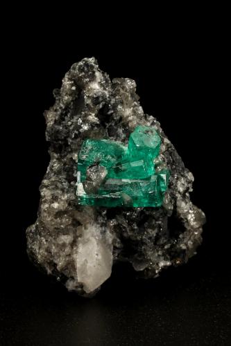 Beryl (variety emerald), Calcite<br />La Pita mining district, Municipio Maripí, Western Emerald Belt, Boyacá Department, Colombia<br />27x40x31mm, aggregate=15x13mm<br /> (Author: Fiebre Verde)