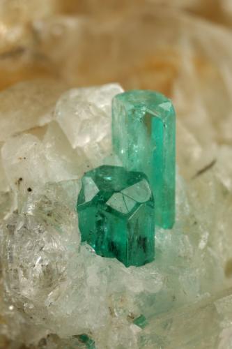 Beryl (variety emerald), Calcite, Quartz, Goethite<br />Peñas Blancas Mine, Municipio San Pablo de Borbur, Western Emerald Belt, Boyacá Department, Colombia<br />49x52x70mm, main xl=7x4mm<br /> (Author: Fiebre Verde)