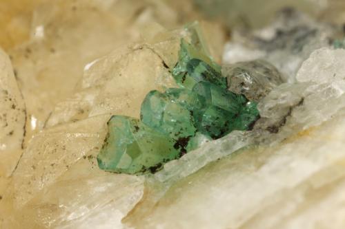 Beryl (variety emerald), Calcite, Quartz, Goethite<br />Mina Peñas Blancas, Municipio San Pablo de Borbur, Cinturón Esmeraldífero Occidental, Departamento Boyacá, Colombia<br />49x52x70mm, main xl=7x4mm<br /> (Author: Fiebre Verde)