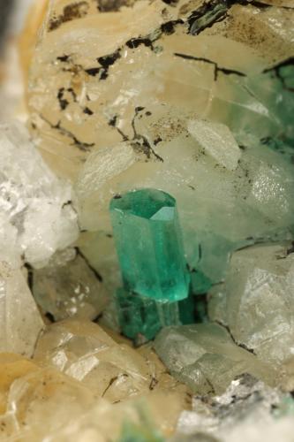Beryl (variety emerald), Calcite, Quartz, Goethite<br />Mina Peñas Blancas, Municipio San Pablo de Borbur, Cinturón Esmeraldífero Occidental, Departamento Boyacá, Colombia<br />49x52x70mm, main xl=7x4mm<br /> (Author: Fiebre Verde)