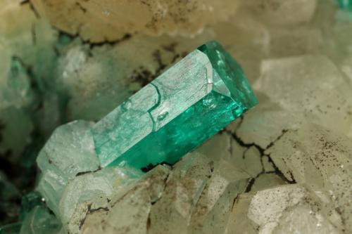 Beryl (variety emerald), Calcite, Quartz, Goethite<br />Peñas Blancas Mine, Municipio San Pablo de Borbur, Western Emerald Belt, Boyacá Department, Colombia<br />49x52x70mm, main xl=7x4mm<br /> (Author: Fiebre Verde)