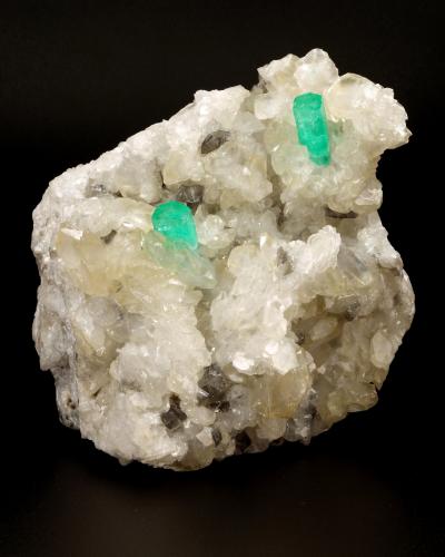 Beryl (variety emerald), Calcite, Dolomite<br />Coscuez mining district, Municipio San Pablo de Borbur, Western Emerald Belt, Boyacá Department, Colombia<br />90x90x80mm, xls=14 & 18mm<br /> (Author: Fiebre Verde)