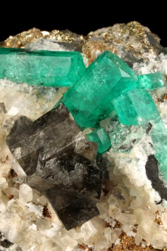 Beryl (variety emerald), Calcite, Dolomite, Pyrite<br />La Pita mining district, Cunas Mine, Municipio Maripí, Western Emerald Belt, Boyacá Department, Colombia<br />60x57x28mm, xls=20mm & 16mm<br /> (Author: Fiebre Verde)