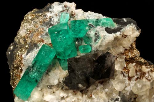 Beryl (variety emerald), Calcite, Dolomite, Pyrite<br />La Pita mining district, Cunas Mine, Municipio Maripí, Western Emerald Belt, Boyacá Department, Colombia<br />60x57x28mm, xls=20mm & 16mm<br /> (Author: Fiebre Verde)