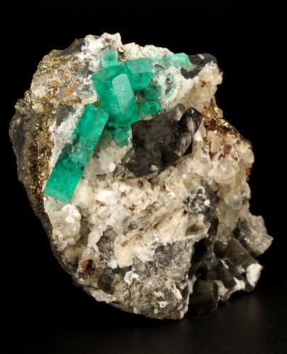 Beryl (variety emerald), Calcite, Dolomite, Pyrite<br />La Pita mining district, Cunas Mine, Municipio Maripí, Western Emerald Belt, Boyacá Department, Colombia<br />60x57x28mm, xls=20mm & 16mm<br /> (Author: Fiebre Verde)