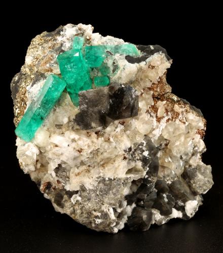 Beryl (variety emerald), Calcite, Dolomite, Pyrite<br />La Pita mining district, Cunas Mine, Municipio Maripí, Western Emerald Belt, Boyacá Department, Colombia<br />60x57x28mm, xls=20mm & 16mm<br /> (Author: Fiebre Verde)