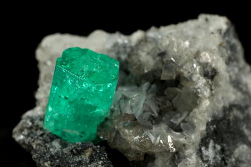 Beryl (variety emerald), Calcite, Dolomite, Pyrite<br />Coscuez mining district, Municipio San Pablo de Borbur, Western Emerald Belt, Boyacá Department, Colombia<br />27x24x35mm, xl=9x6mm<br /> (Author: Fiebre Verde)