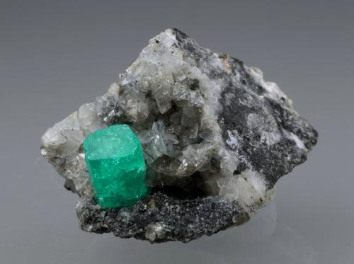 Beryl (variety emerald), Calcite, Dolomite, Pyrite<br />Coscuez mining district, Municipio San Pablo de Borbur, Western Emerald Belt, Boyacá Department, Colombia<br />27x24x35mm, xl=9x6mm<br /> (Author: Fiebre Verde)