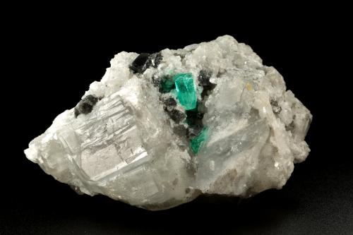 Beryl (variety emerald), Calcite, Dolomite<br />Coscuez mining district, Municipio San Pablo de Borbur, Western Emerald Belt, Boyacá Department, Colombia<br />85x50x50mm, xl=10mm<br /> (Author: Fiebre Verde)