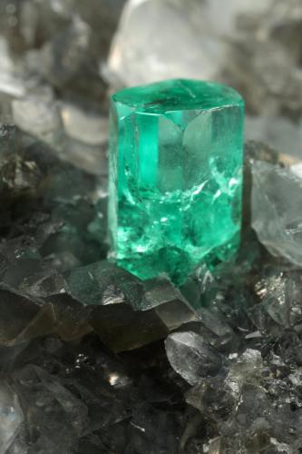 Beryl (variety emerald), Calcite, Dolomite, Pyrite, Quartz<br />La Pita mining district, Cunas Mine, Municipio Maripí, Western Emerald Belt, Boyacá Department, Colombia<br />66x49x24mm, main xl=6x4mm<br /> (Author: Fiebre Verde)