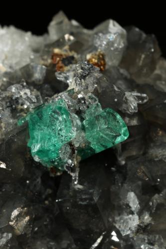 Beryl (variety emerald), Calcite, Dolomite, Pyrite, Quartz<br />La Pita mining district, Cunas Mine, Municipio Maripí, Western Emerald Belt, Boyacá Department, Colombia<br />66x49x24mm, main xl=6x4mm<br /> (Author: Fiebre Verde)